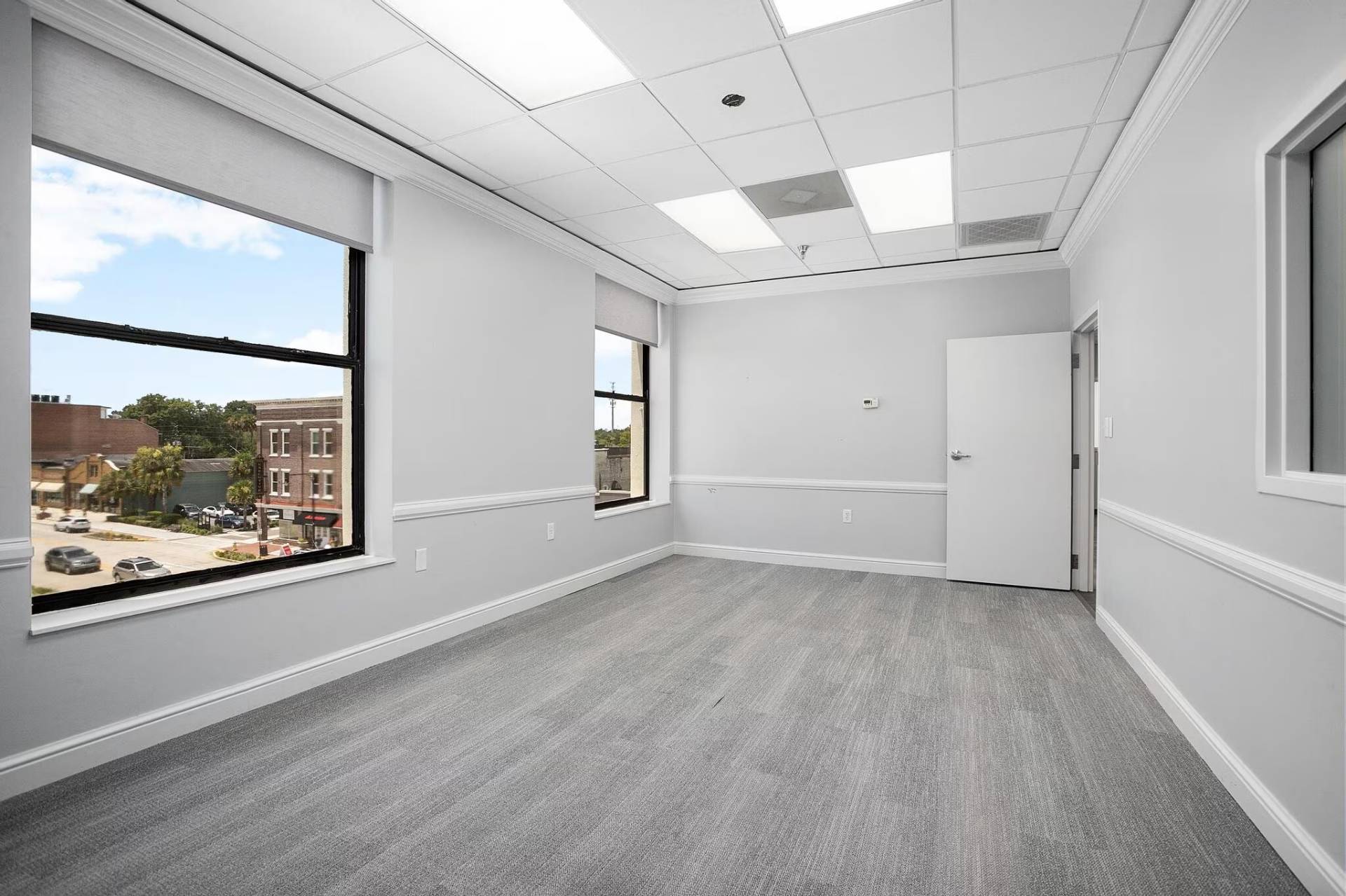 Professional office suite with large windows overlooking downtown DeLand